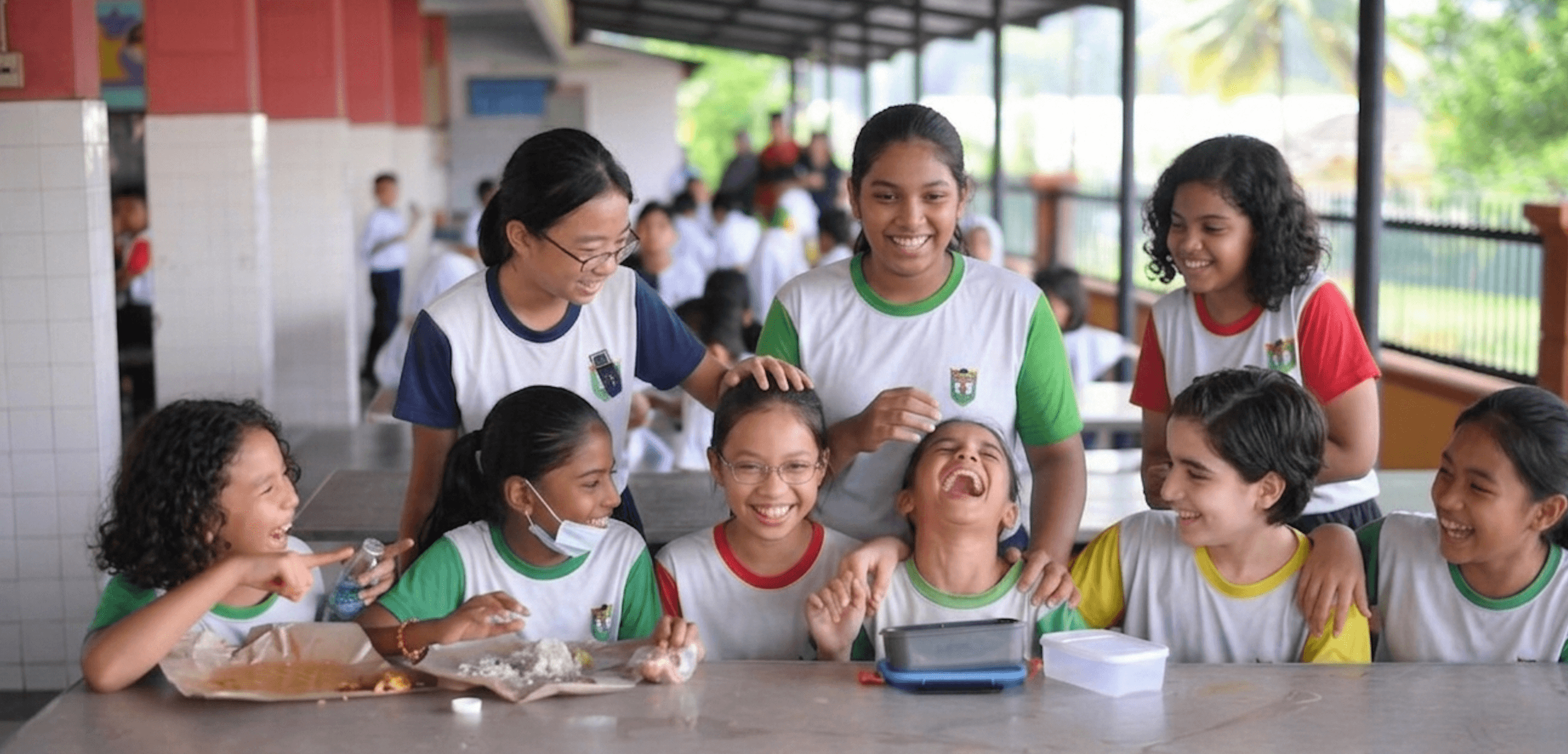 Malaysian students laughing and bonding together at school